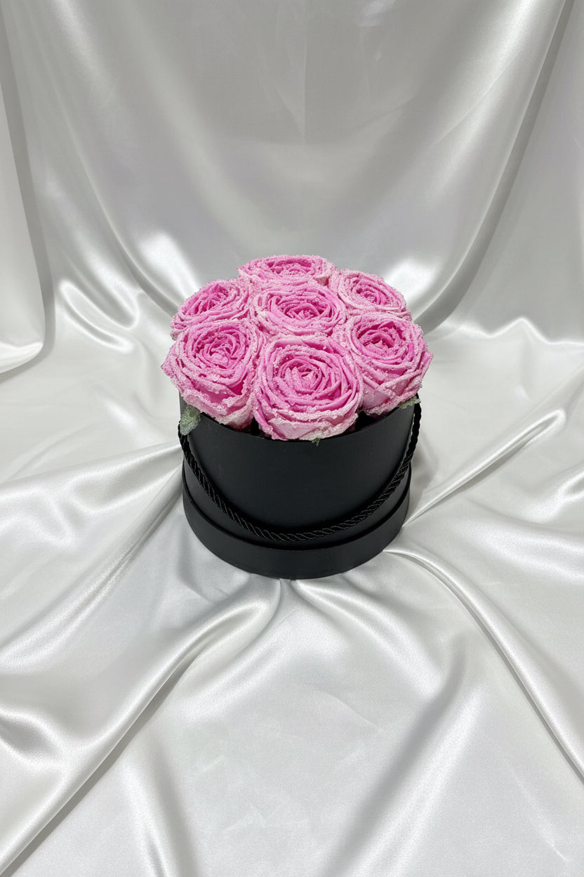 Black box with pink roses on a dark background