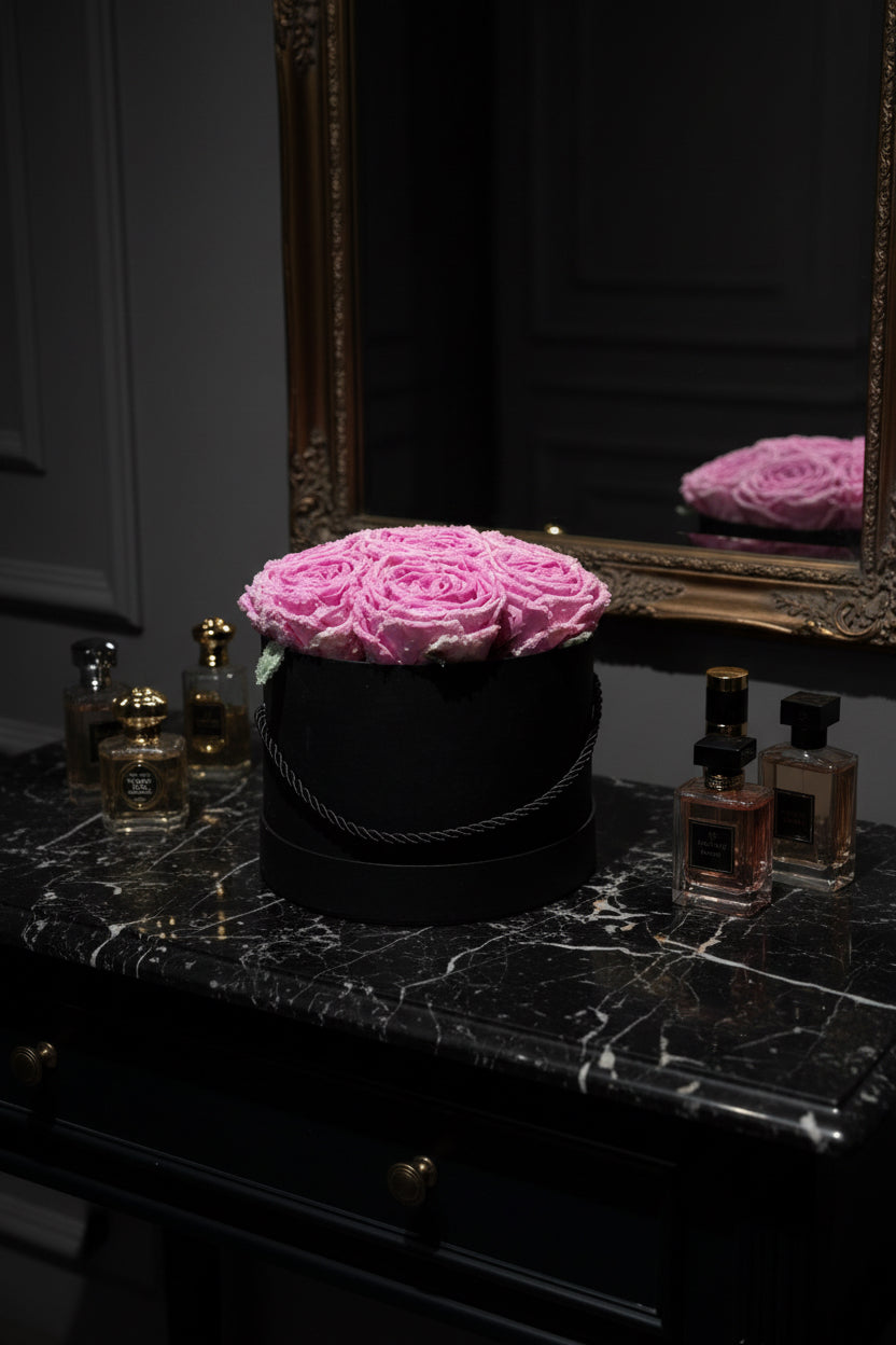 Black box with pink roses on a black background
